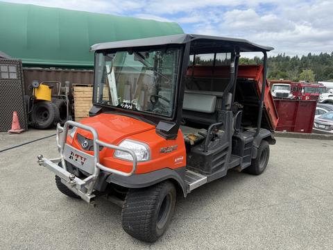 A 2011 Kubota RTV 1140 CPX utility vehicle featuring an orange exterior with a black roof and a spacious cab for passengers and cargo