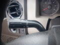 A close-up view of the control lever in a 2008 Ford F-550 for windshield wipers with markings for different settings including off