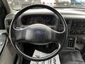 Steering wheel and dashboard of a 2008 Ford F-750 displaying speedometer and various gauges