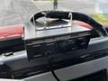 A Federal Signal Corporation PA300 control unit with knobs for horn, radio, siren, and gain mounted on a dashboard