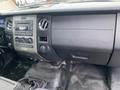 Interior dashboard of a 2017 Ford Expedition featuring control knobs air vents and a center console