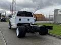 A white 2008 Dodge Ram 5500 with an incomplete truck bed and exposed chassis viewed from the rear angle