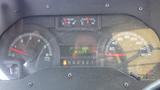 Dashboard of a 2011 Ford Econoline displaying speedometer RPM gauge fuel gauge and temperature reading with lights indicating gear position