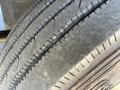 Close-up of a tire from a 2010 Freightliner MT45 Garbage Truck showing detailed tread patterns and wear on the rubber surface