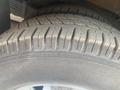 A close-up of a tire on a 2017 Chevrolet Express showing the tread pattern and sidewall details