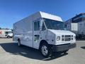 A white 2007 Freightliner MT55 box truck with a flat front and large windshield parked at an angle showing its side and front views