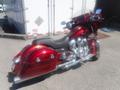 A 2017 Indian Chieftain Elite motorcycle with a striking deep red finish and chrome accents showcasing its elegant design