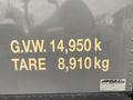 A close-up view of a 2018 Hino 308 display showing G.V.W. 14,950 k and TARE 8,910 kg in large yellow lettering