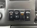 Controls on the dashboard of a 2008 Ford F-750 including cruise control and various settings buttons