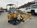 A yellow and black 2024 AGT Industrial MX12R mini excavator with a bucket attachment and protective covering on the arm