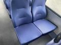 Two blue upholstered seats in a vehicle interior designed for comfort and durability