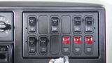 Control panel of a 2008 International 7500 featuring multiple switches and indicators for various functions like lights and heating