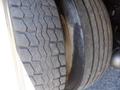 Close-up of a 2008 Peterbilt 335 tire showing detailed tread pattern and wear on the rubber surface