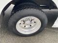 Close-up view of a tire mounted on a 2005 Freightliner MT45 Chassis showcasing tread pattern and alloy wheel design