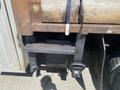 Close-up of a 2010 Ford F-550's rear hitch and mounting components showing signs of wear and rust
