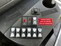 Control panel of a 2015 Chevrolet Express featuring buttons for rear AC, lift operation, door control, and lights