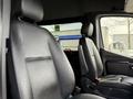Interior view of a 2019 Mercedes-Benz Sprinter showing two black leather front seats with headrests visible