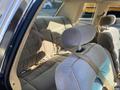 Interior view of a 1982 Mercury Grand Marquis showing the backseat with upholstered seating and seatbelts