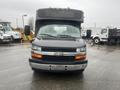 A front view of a 2017 Chevrolet Express van featuring a black exterior with a silver grille and Chevrolet logo