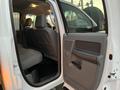 Interior view of a 2008 Dodge Ram 5500 showing the driver's side door open with gray seats and dashboard visible