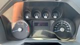 Dashboard of a 2011 Ford F-450 SD featuring various gauges for RPM fuel and vehicle speed