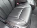 A black leather seat from a 2008 Cadillac Limousine designed for luxury with plush cushioning and tailored stitching