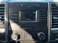 Dashboard of a 2017 Ford F-150 featuring an audio system with control buttons and a digital display showing the time and date