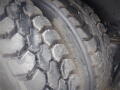 Close-up of a rugged tire with deep treads designed for heavy-duty vehicles like the 2008 International 7400