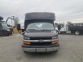 Front view of a 2017 Chevrolet Express van with a black exterior and large windshield