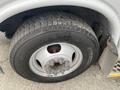 Close-up of a tire on a 2017 Chevrolet Express showing detailed tread pattern and wheel rim with five lug nuts