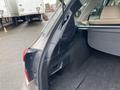 Interior view of a 2019 Subaru Outback showing the rear cargo area and side panel details with a seat in the background