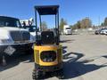 2024 AGT Mini Excavator with a compact design and tracks visible in the foreground showcasing its operational features and controls