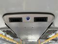 Ceiling air vents and lights of a 2017 Chevrolet Express with molded panels and yellow grab rails visible beneath the vents