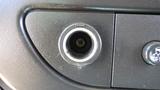 Close-up of a power outlet in a 2012 GMC Savana dashboard