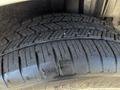 A close-up of a tire tread from a 2013 Lincoln MKT showing deep grooves and patterns for traction