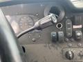 Close-up of the control panel in a 2011 Ford Utilimaster Food Truck featuring gauges switches and a gear shift lever