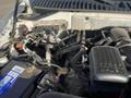 Detailed view of the engine compartment of a 2013 Ford Expedition showcasing the engine components and wiring