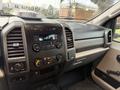 Dashboard of a 2017 Ford F-350 SD featuring controls for audio and climate with a display screen and the Super Duty logo