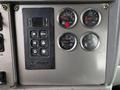 Control panel featuring gauges for fuel, DEF, air filter, and a transmission control system in a 2014 Kenworth T370