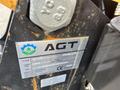 A close-up of a metal identification plate on a 2024 AGT Mini Excavator displaying the AGT logo and specifications for model H12R and weight of 845 kg