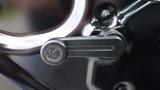 Close-up of a mechanical lever on a 2018 Kubota RTV X1100c showcasing its smooth metallic design and branding detail