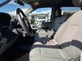 Interior view of a 2019 Ford F-350 SD showing the driver's seat and dashboard with fabric upholstery and controls