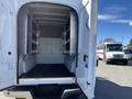 A 2019 Ford F-350 SD truck with an open cargo space featuring metal shelving units along the walls