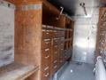 Interior of a 2007 Morgan Olson Workhorse W42 featuring wooden shelving with multiple drawers and compartments for storage