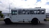 A 2015 International PC105 bus in white with large windows and a blue light on top