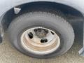 Close-up of a tire on a 2017 Chevrolet Express showing the Michelin brand with visible wear and a metallic rim