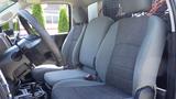 Interior view of a 2014 RAM 5500 with gray fabric seats featuring a simple design and a spacious layout