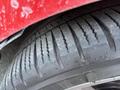 Close-up of a tire from a 2018 Ford Focus showing tread pattern and details of the rubber surface