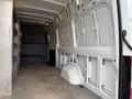 Interior of a 2019 Mercedes-Benz Sprinter van showing a spacious, empty cargo area with metal walls and a flat floor