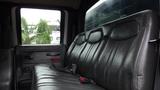 Interior view of a 2008 Chevrolet C7500 showing the black leather bench seat with seatbelt and armrest